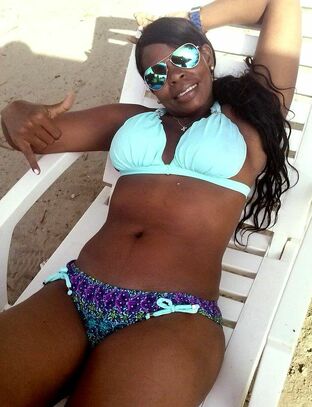 Sumptuous black femmes in bikinis in  from vacation