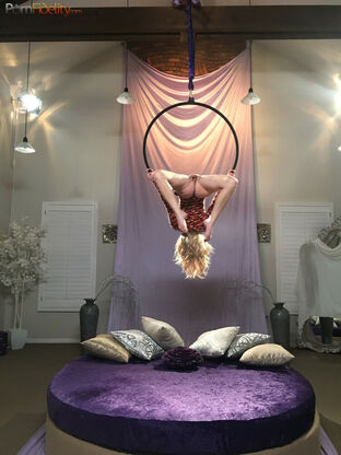 Excellent platinum-blonde chick Arya Fae doing aerial yoga