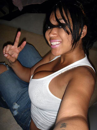 Super-naughty black teensy female poses naked and displays..